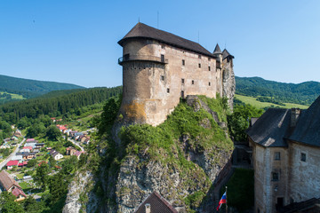 Naklejka premium Orava castle - Oravsky Hrad in Oravsky Podzamok in Slovakia. Medieval fortress on extremely high and steep cliff. Aerial view.