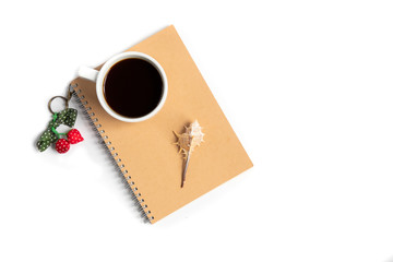 Fototapeta na wymiar cup of coffee and a seashell on a notebook