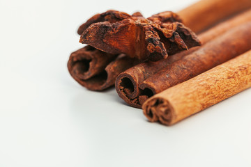 Cinnamon sticks isolated on white background close up