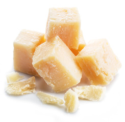 Parmesan cheese cubes isolated on white background.