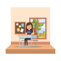 little student girl in school desk on the classroom