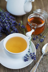 Cup of tea and honey with lavender flowers
