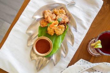 Vegetable fritters with tomato sauce