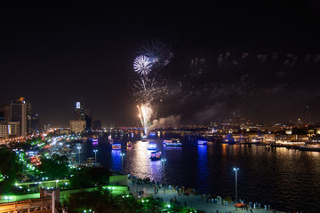 Fototapeta na wymiar Fireworks over Dubai creek in Deira to celebrate the end of Ramadan in Dubai