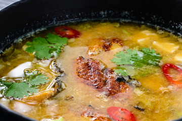 Tom yam kong or Tom yum, Tom yam is a spicy clear soup typical in Thailand. Thai food.