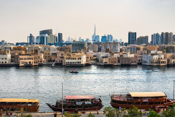 Fototapeta na wymiar Dubai modern skyline view from the creek in Deira in United Arab Emirates