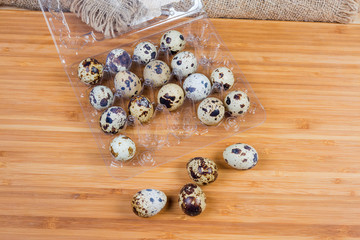 Quail eggs in open special package and beside to her