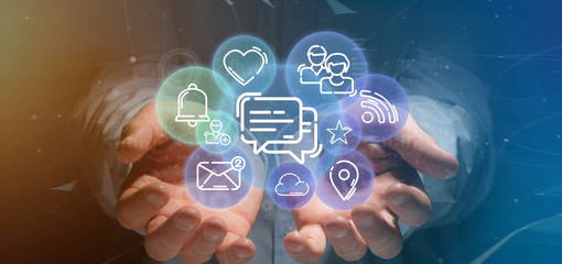 Businessman holding a cloud of social media network icon