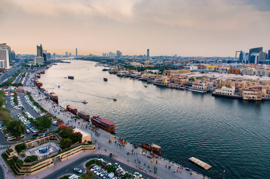  Boats on Dubai creek in Deira with the view of old Dubaiai in United Arab Emirates