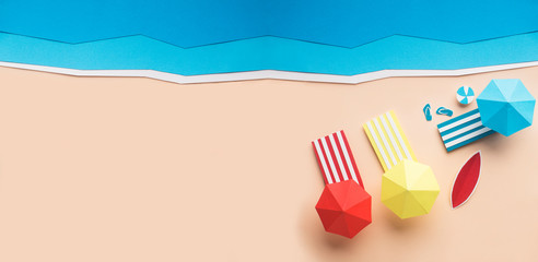 Summer creative wallpaper with sandy beach, sea and umbrellas