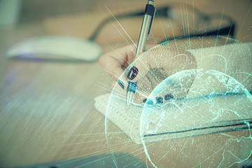 Social network theme hologram over hands taking notes background. Concept of global international people connect. Double exposure