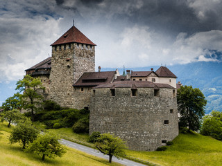 Fototapeta na wymiar A view of the historic Vaduz Castle in the capital of the Principality of Liechtenstein on an overcast summer day