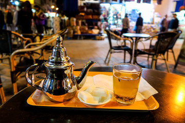 cup of tea with teapot, photo as background