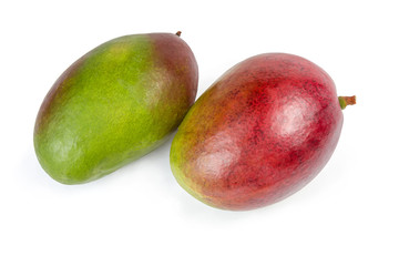 Two ripe mango fruits on a white background