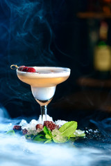 cocktail clover club with smoke from hookah on bar counter