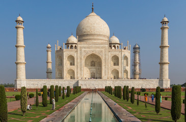 Fototapeta na wymiar Agra, India - probably the most recognizable landmark of India, the Taj Mahal is an ivory-white marble mausoleum dedicated to the Emperess Mumtaz Mahal. Here in the picture it's unmistakable shape