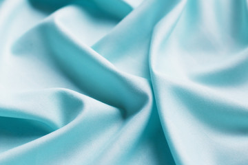 Turquoise wavy fabric, Texture, background. template. Lightweight fabric. Fabric for curtains or tulle