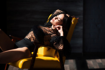 Fashion vogue style portrait of young stunning woman posing in sunset lightning with shadows in...