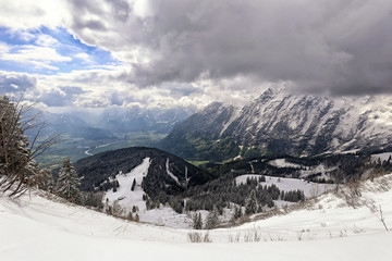 Fototapeta na wymiar Deep Alpine valley by Salzburg city under high mountains