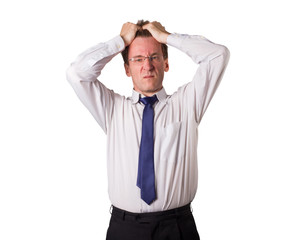 Office worker clutches his head. Things are going bad. Isolated. White young man