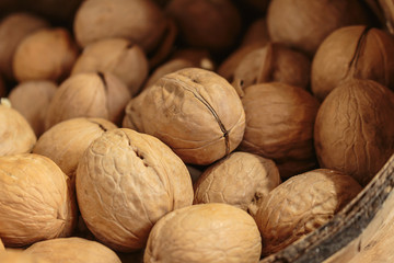 Walnuts in the basket on white background