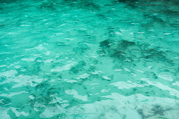 The rippled water of emerald sea