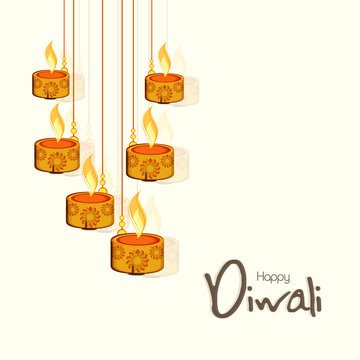 Diwali celebration concept with hanging illuminated lit lamps.