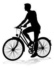 Obraz premium A bicycle riding bike cyclist in silhouette