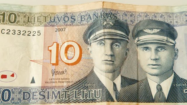 Close-up pan shot of an old, by now discontinued, 10 litas bank note by the Bank of Lithuania.