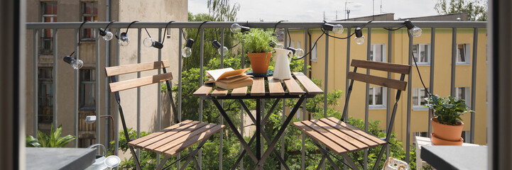City balcony with wooden table