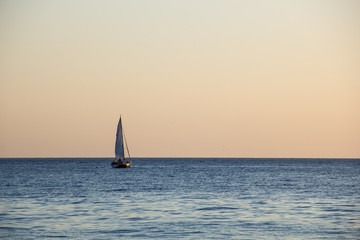 Fototapeta na wymiar Sailing Yacht In The Sea At Sunset. Black Sea.