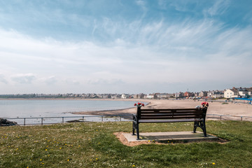 Obraz premium Park benches and church at Newbiggin in Northumberland