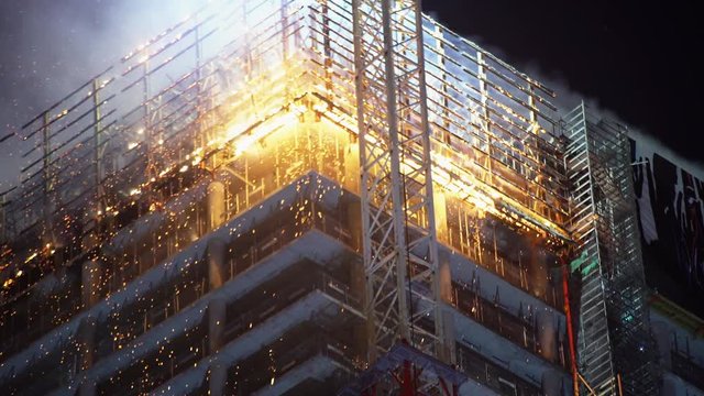 Fire on a high-rise office building in Warsaw during the night.