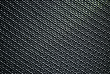Black background with grille pattern.