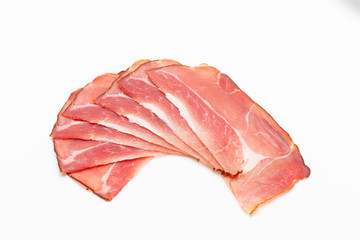 Hamon sliced on white background. Spanisch traditional meat.