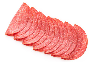 Salami slices on white background.
