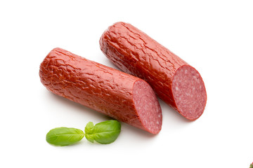 Salami smoked sausage, basil leaves on white background cutout.