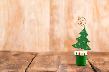 Christmas greeting card wooden background.