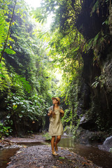 Fototapeta na wymiar Woman in jungle on Bali, Indonesia 