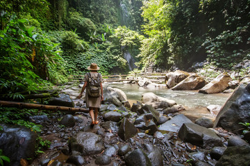 Woman near Nung Nung waterfal on Bali, Indonesia