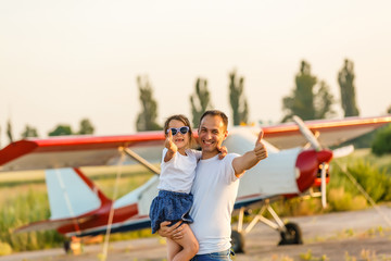 dad and 7 year old child playing plane