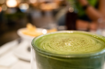 cup of matcha milk tea on table
