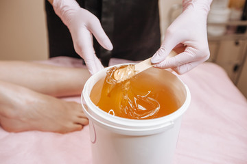 Sugar for waxing. Depilation concept.