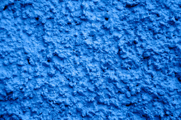 Fototapeta na wymiar An old ragged plaster blue wall texture, cracked and old for background,rough cement wall