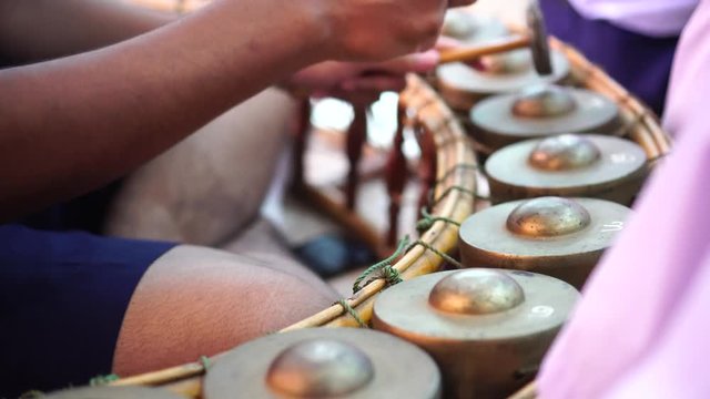 Asian playing thai traditional music instrument.