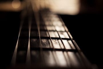 Acoustic Guitar In Music Studio Close up. Shined By The Sun At The Golden Hour