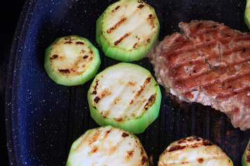 Meat and zucchini on the grill pan. Healthy food. Healthy food at home
