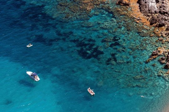 Boats anchoring at the beach Platja of the Coll Baix in the turquoise blue water, peninsula near Alcudia, Majorca, Balearic Islands, Spain, Europe