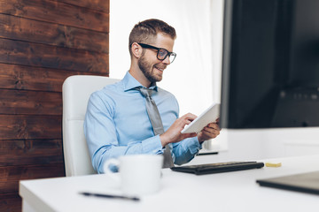 Fototapeta premium Successful businessman working in his office