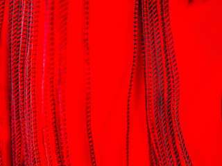 Abstract background of red and black fabrics texture and stripes or lines pattern .